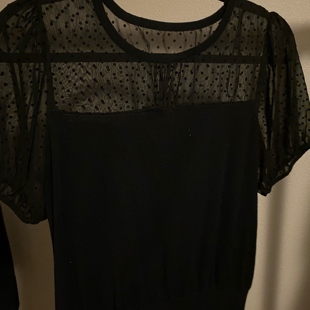 Black with polka dot sleeves